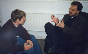 Father McCartney in discussion