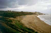 The beach, and site of the harbour. Temple E in the background