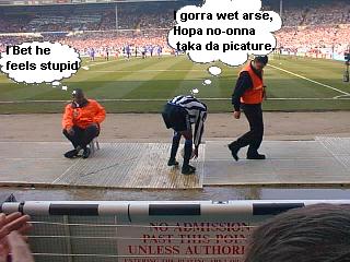 Nobby slips up , in front of the Newcastle fans.