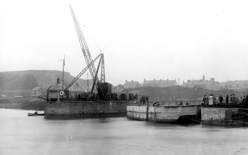Block-ship in position at Harrington harbour.  Harbour used as a seawater pumping-station, 10th October 1940.