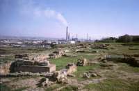 The remains of the ancient Acropolis at gela, with the petrochemical works in the background