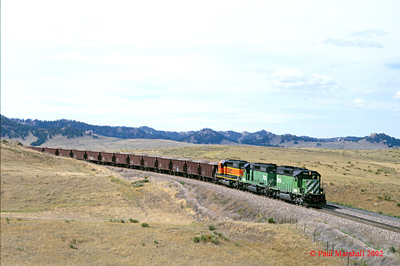 BNSF SD40-2's #8058 + #7032 + #7327 at the Lower Horseshoe, Crawford with a ballast train - Sept 2002