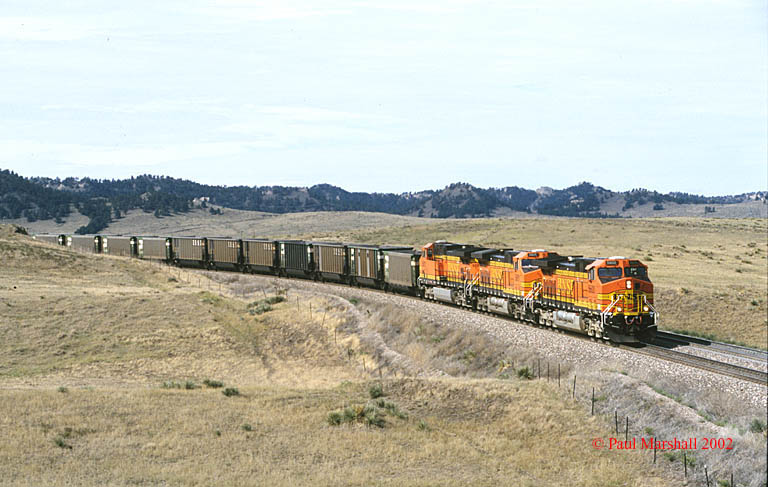 BNSF AC4400's #5600 + #5601 + #5602 approaching the Lower Horseshoe, Crawford with W/B empties- Sept 2002