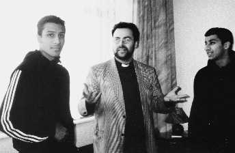 Father Jim pictured with 2 students studying at Blackburn College for Public Services