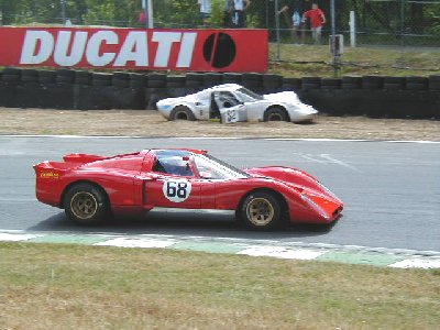 The Chevron B16 of Sheldon Cope passes the parked B6 of Aylett Jones at 