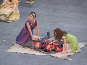 Antigone and Ismene mourn over the bodies of their brothers Eteocles and Polyneices