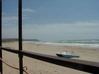 The long empty beach in March. Click to enlarge and spot Leon in the distance!