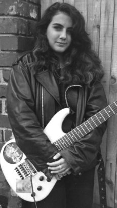 Mel posing with her guitar