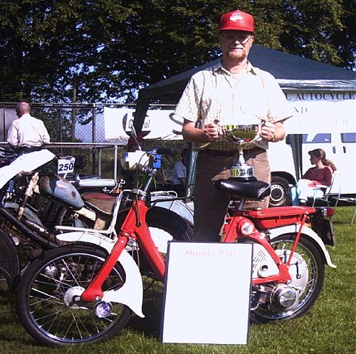 Jim Lawrence with his prize and Honda P50