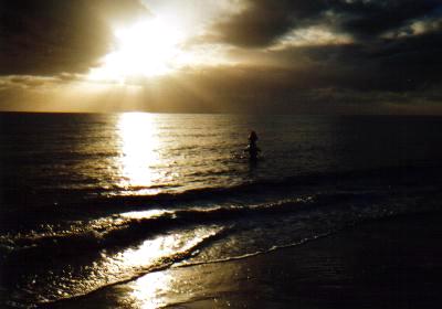 Mels on Rebecca's shoulders walks out of sunset.