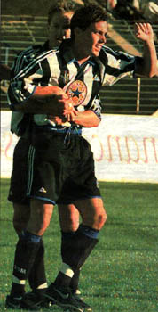 McClen gets a cuddle from Coppinger after the first goal