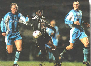 Saha nips between Coventrys defence