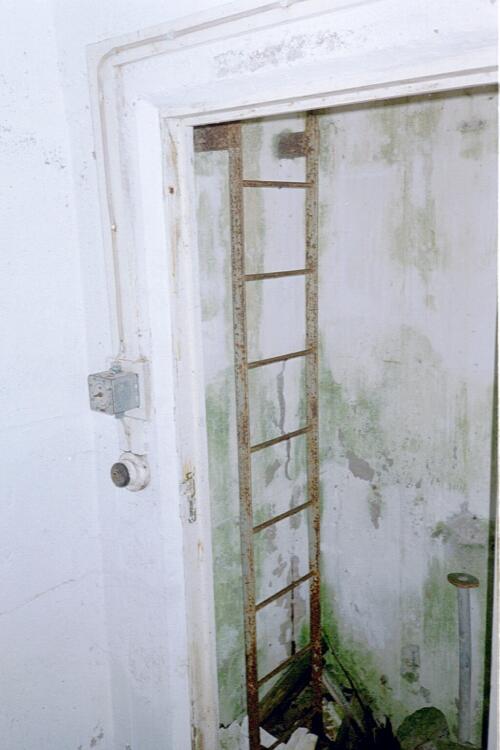 Inside the post, the ladder shaft and light switch.