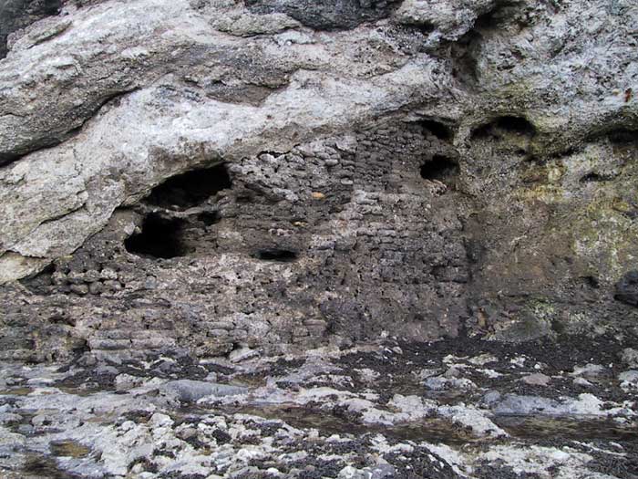 The concrete-filled sandbag reinforcement at the foot of the cliffs immediately below No:1 gun.