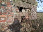 The hole beneath the embrasure for a 'Boys' Anti-Tank rifle.