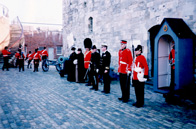 Commander C.A. Melhuish USN takes the salute at a march past of the Fort Cumberland Guard and Corps of Drums